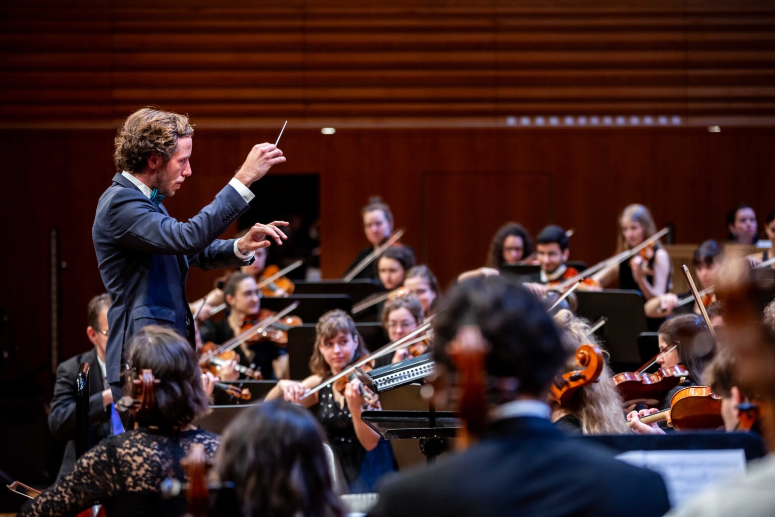 Joseph Sieber conducting an orchestra